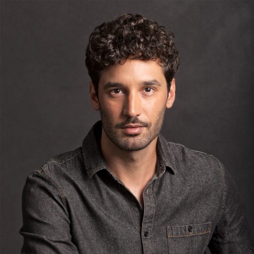 Male model headshot with grey backdrop